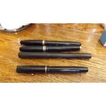 Four mid 20th century fountain pens, one