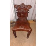 A 19th century mahogany hall chair with