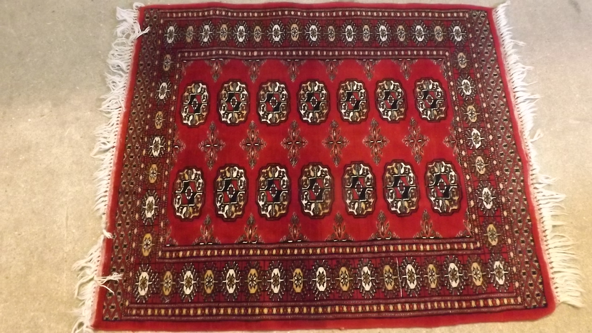 A small 20th century hand woven rug with