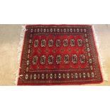 A small 20th century hand woven rug with