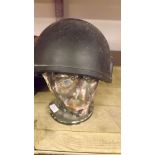 A 20th century combat helmet and polysty