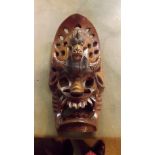 A highly decorated tribal carved wooden