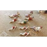 Nine 20th century porcelain figurines de