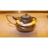 A silver oval mustard pot with hinged co