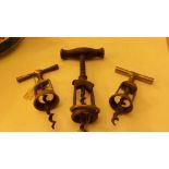 Three vintage corkscrews, one being The