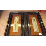 A pair of brass panels mounted in frames