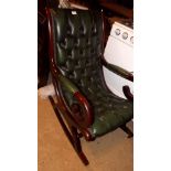 A Victorian style rocking chair with mah