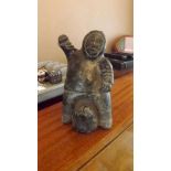 A 20th century Inuit figure depicting In