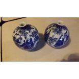 A pair of antique bulbous blue and white
