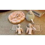 Four 19th century porcelain doll powder