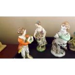 Three antique figurines depicting girl w