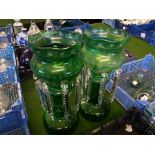 A pair of green glass pedestal lustres b