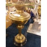A vintage brass columned oil lamp with s