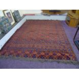 A PERSIAN RUG 10ft X7ft A DOUBLE PURPLE & RED BORDER WITH A CENTRAL GEOMETRIC PATTERN EST [£80-£