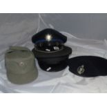 TWO MILITARY PEAKED HATS , BERRY WITH INSGNIA & GDR PEAKED CAP EST[£20-£40]