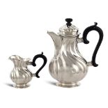 Silver teapot and milk jug Germany, 20th century weight gross 838 gr.