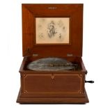Regina Double Comb Music Box. circa 1900. (11) 15 1/2" disks. Inlaid mahogany case. Working order.