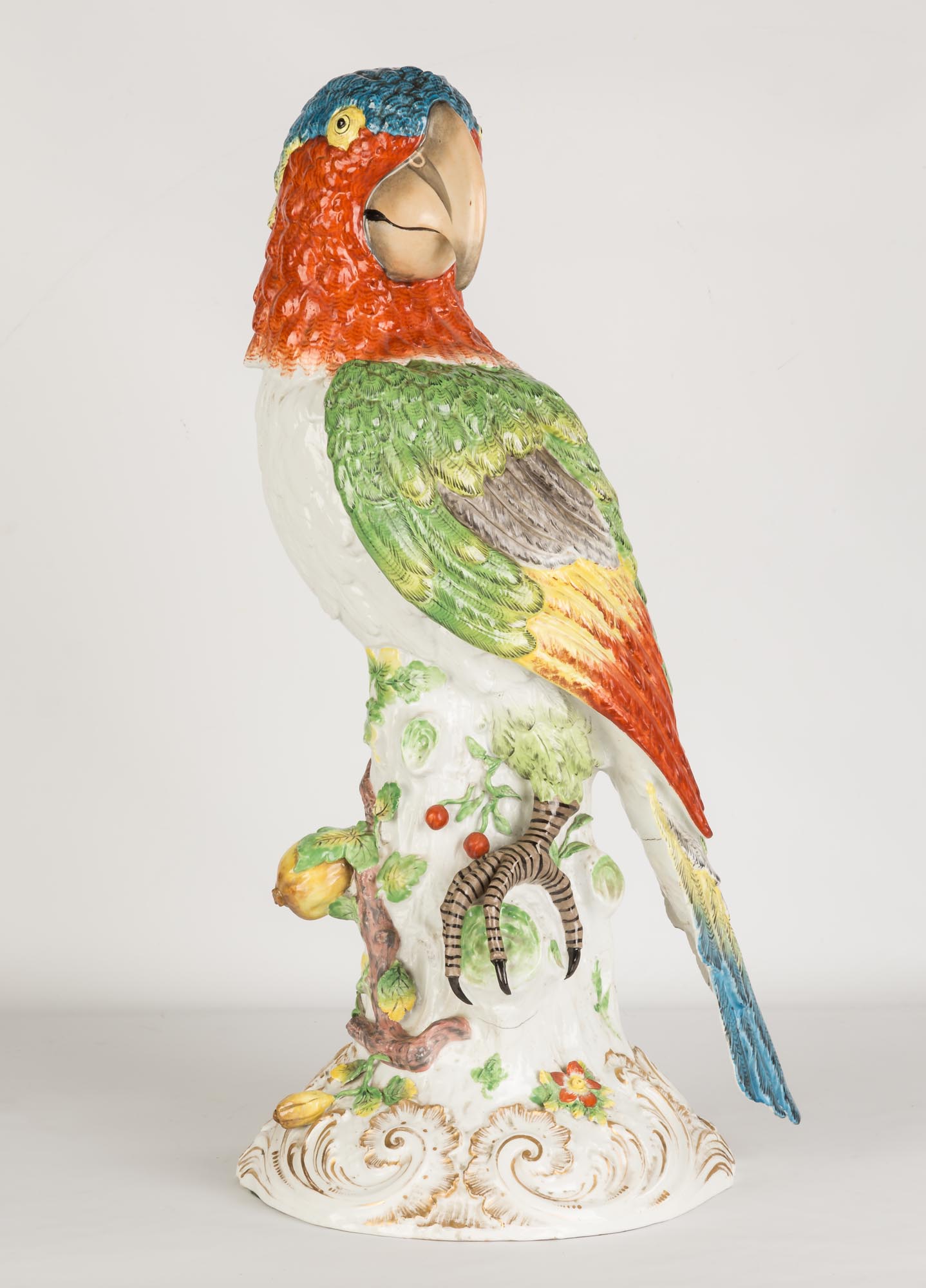 Monumental German Porcelain Parrot. 19th century. Hand painted porcelain. Crossed swords with two