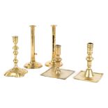 Group of Five Early Brass Candlesticks. Max Ht 8 1/2". Online bidding available: https://live.