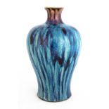 Two Chinese Flambe Vases. One with sang de boeuf glaze. Max Ht. 12" . Online bidding available: