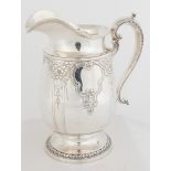 Gorham Special Order Sterling Silver Water Pitcher. Early 20th century. Hand chased floral and