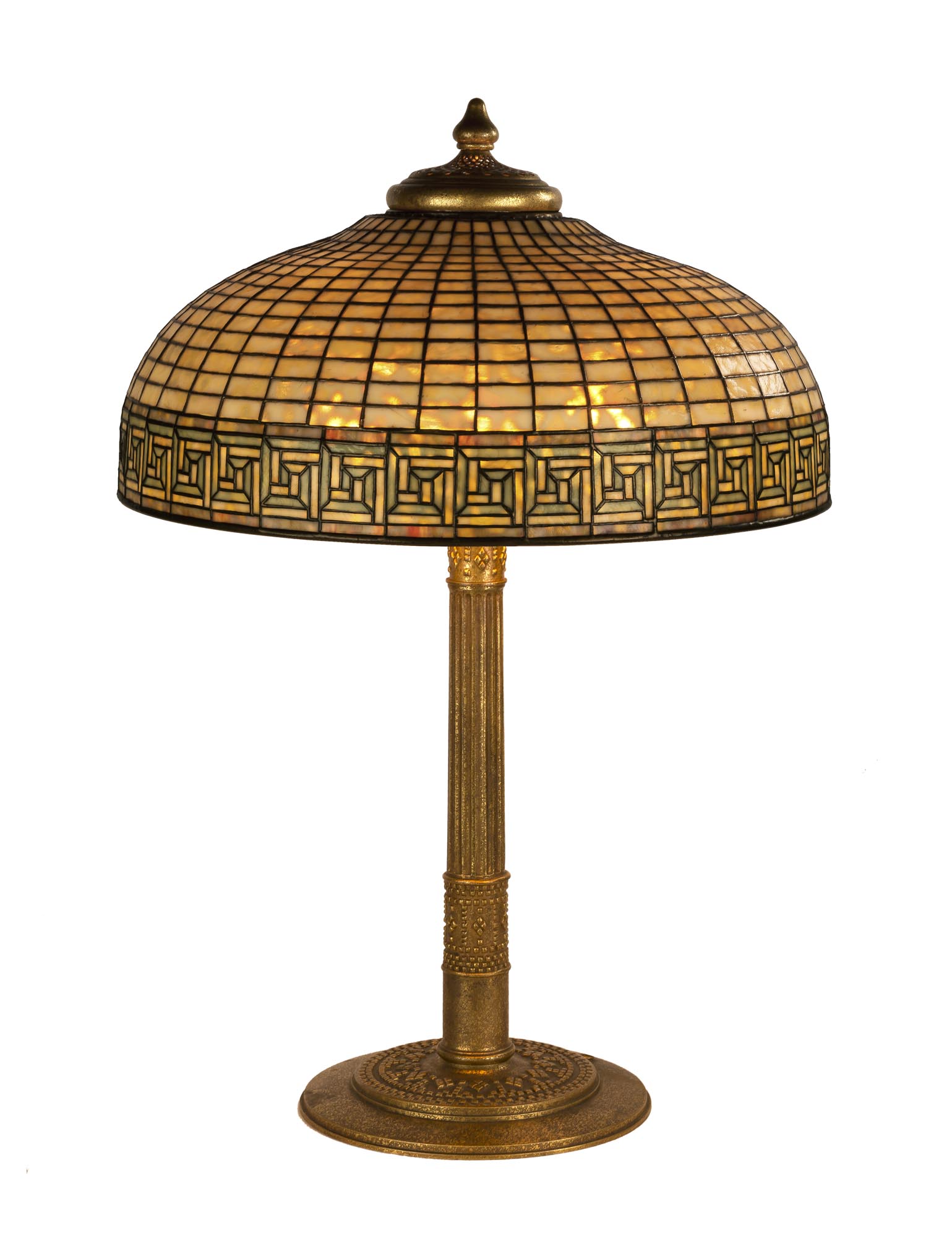 Tiffany Studios, New York, "Greek Key" Table Lamp. circa 1910. Leaded glass and gilded bronze. Shade