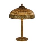 Tiffany Studios, New York, "Greek Key" Table Lamp. circa 1910. Leaded glass and gilded bronze. Shade