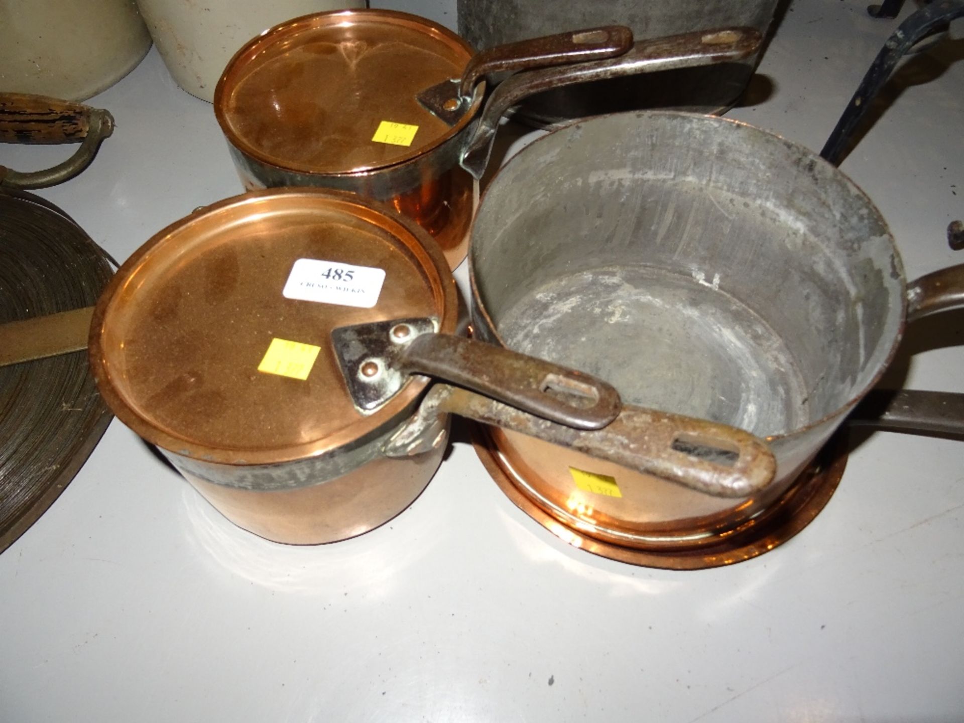 THREE COPPER SAUCEPANS WITH LIDS