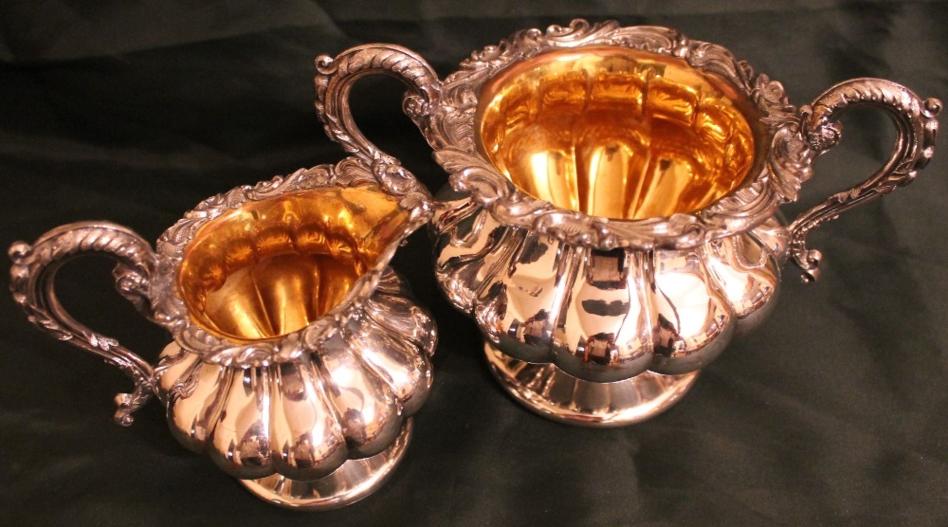 SILVER PLATED AND GILT MILK JUG AND SUGAR BOWL