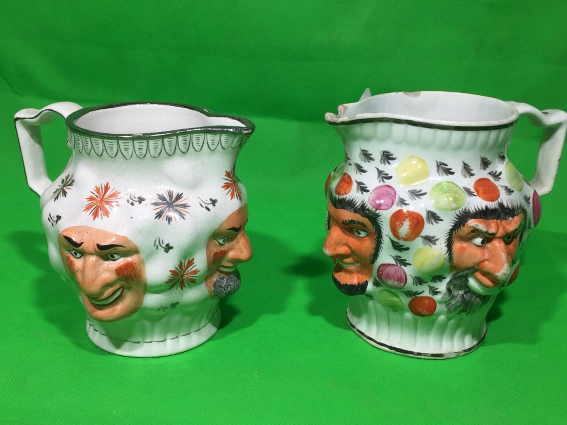 TWO STAFFORDSHIRE FACED MILK JUGS