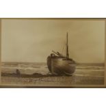 A bromide photograph, SM 73, a beached fishing boat, Brighton, by H. Griffiths, labelled and