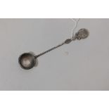 A Chinese silver spoon with coin handle and end, marked silver with maker's mark, 39g