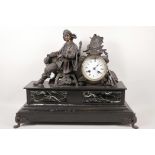A French spelter mantel clock with enamel dial and Roman numerals, the movement striking on a bell ,