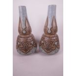 A pair of Doulton Lambeth silicon ware vases of double gourd form with painted and incised Persian
