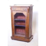 A C19th walnut music cabinet of small proportions with a three quarter brass railed gallery, 22" x