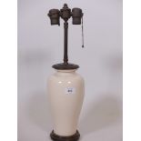 A crackle glazed porcelain lamp with finely carved wood mounts, 20" high