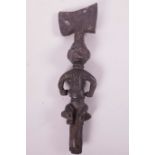 An African carved wood tribal staff, the head carved as a seated figure