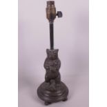 A Continental bronze lamp base cast as a standing bear, 14" high