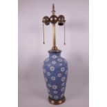 A cloisonné vase shaped table lamp with floral decoration, bronze base and column, 23" high