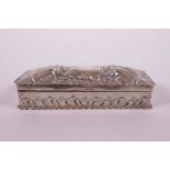 A hallmarked silver trinket box with repoussé decoration and inscribed 'Xmas 1897', Birmingham 1896,