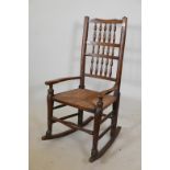 A C19th ash Lincolnshire spindle back rocking chair