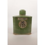A Chinese green crackle glazed pottery tea canister, character marks to side, 8½" high