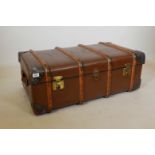 An early C20th leather travelling trunk, the hessian interior with fitted tray, bears label Jones,