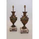 A pair of gilt spelter table lamps, on marble bases with brass mounts, 20" high