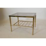 A brass occasional table with slatted undertier and tinted glass top, 22" x 18" x 16"