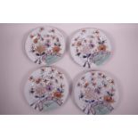 Four ironstone plates decorated in the Oriental fence pattern in the Imari palette, 8" dia