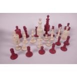 A carved and dyed bone part chess set, twenty four pieces