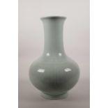 A large celadon glazed porcelain vase with archaic style underglaze decoration, 6 character mark