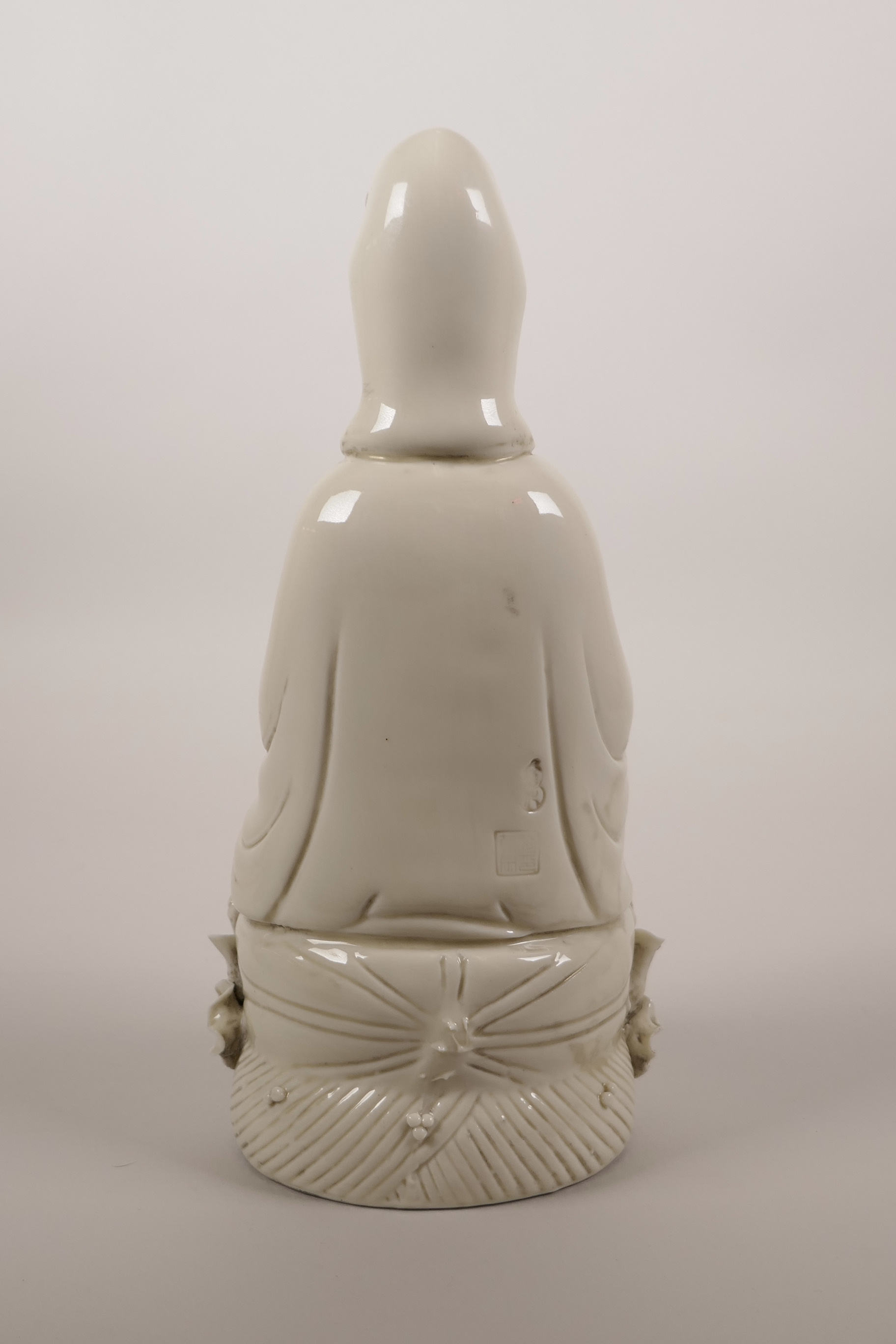 A Chinese blanc de chine porcelain figure of Quan Yin seated on a lotus throne, impressed marks - Image 2 of 3