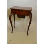 A C19th inlaid burr walnut shaped work table, with lift up top revealing a maple interior with